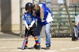 Kid learning how to bat