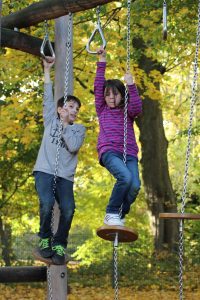 kids swinging on playground