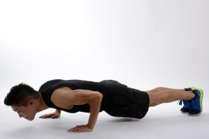 Man doing a plank in push-up position